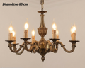 Lustre en bronze à bras courbés et décor de feuillage, diamètre 65 cm